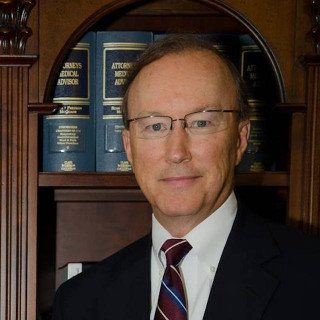 Photo of John E. Suthers
