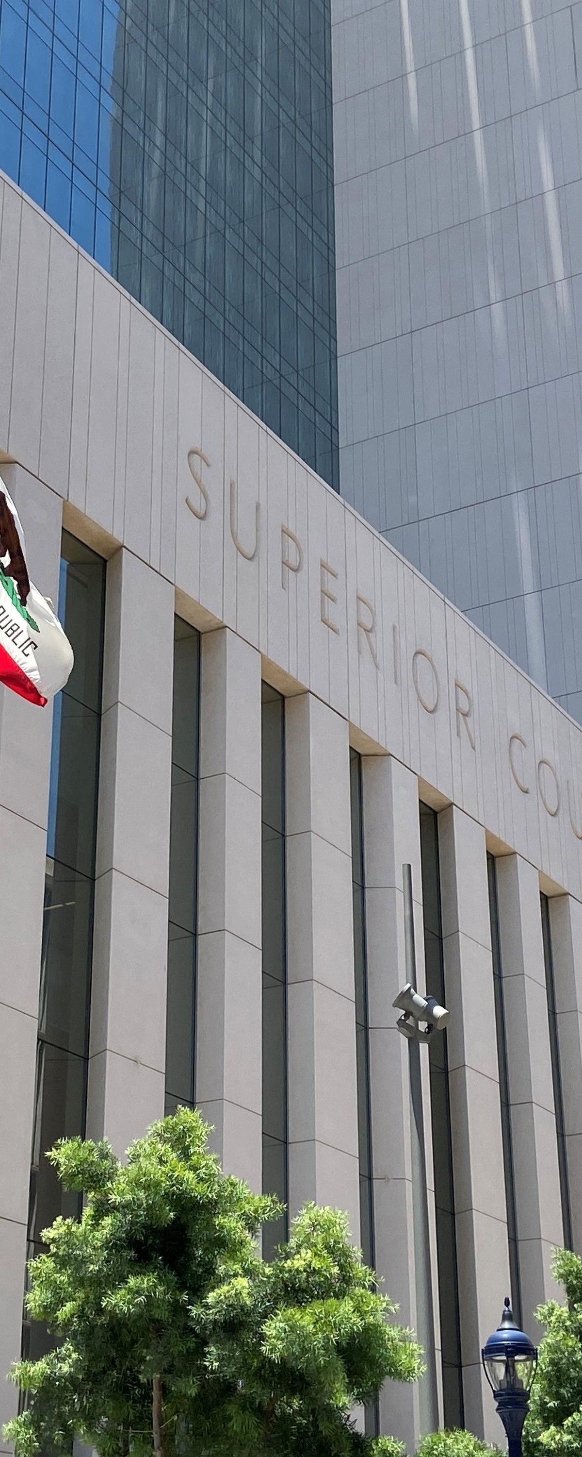 Superior Court of California building facade with U.S. and California state flags, where Weiss et al. v. FCTI settlement was approved.