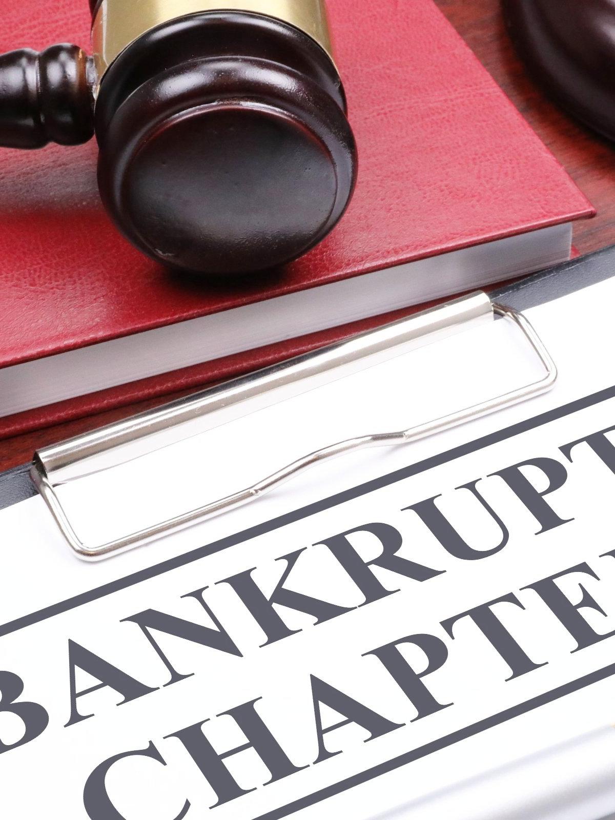 Wooden judge's gavel on a red book beside a clipboard labeled Bankruptcy Chapter 13, illustrating Los Angeles Chapter 13 attorney representation.